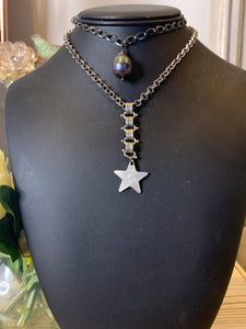 Star necklace on silver book chain.