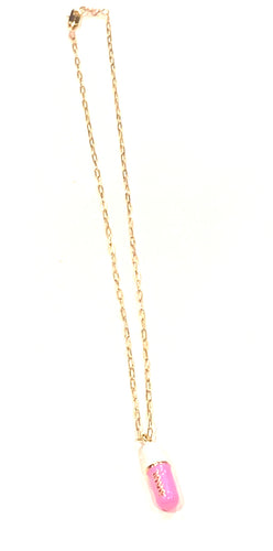 Love pill pendant necklace.